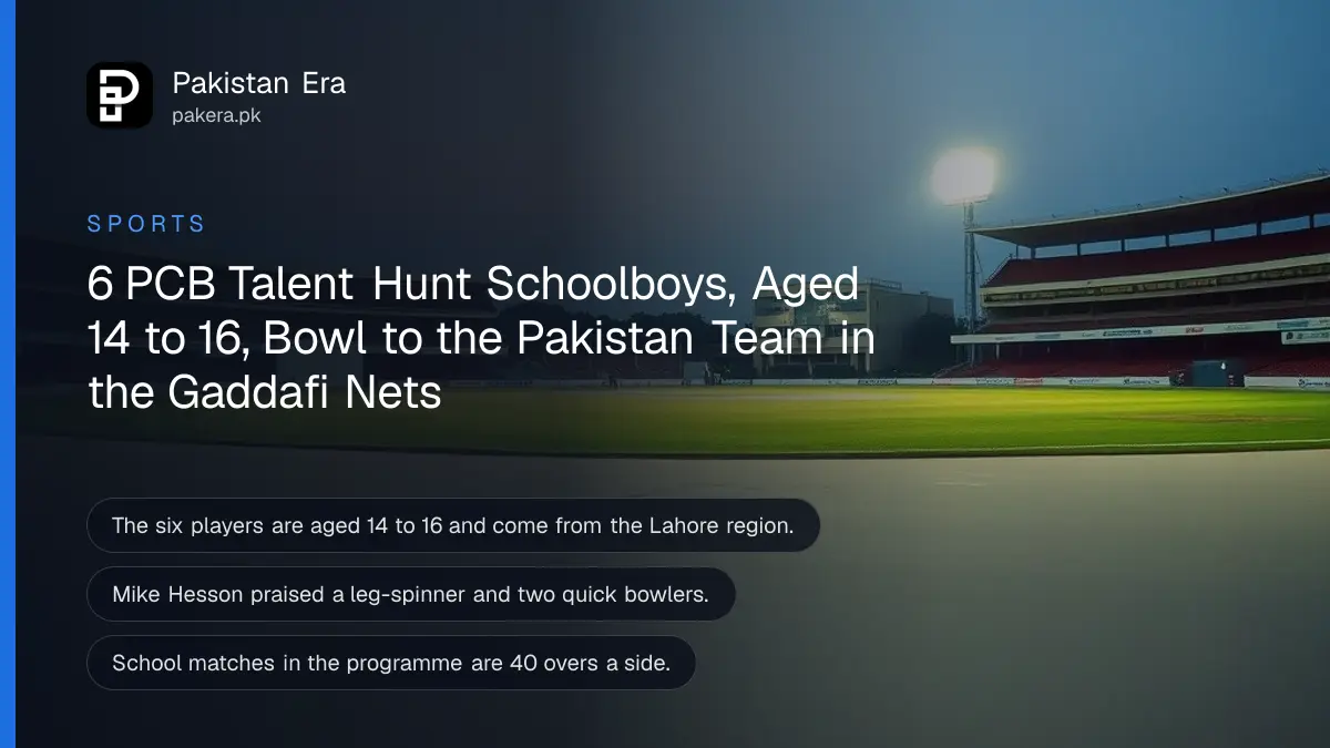 An empty cricket stadium under floodlights