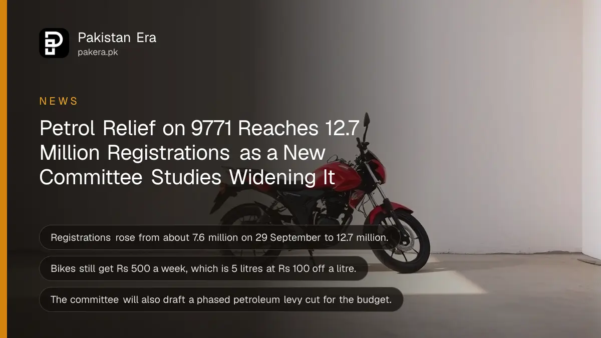 A motorcycle parked against a white wall