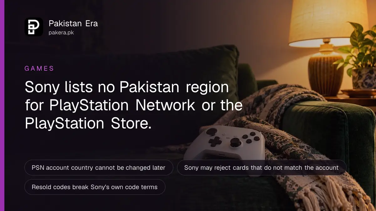 A game controller resting on a sofa cushion in warm evening lamp light in a Karachi living room