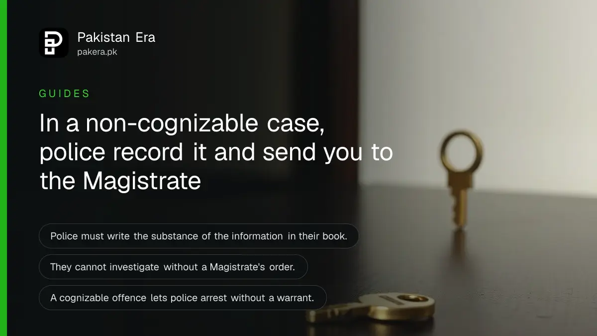 A brass key on a dark wooden table, for a guide to what to do when police say an offence is non-cognizable in Pakistan
