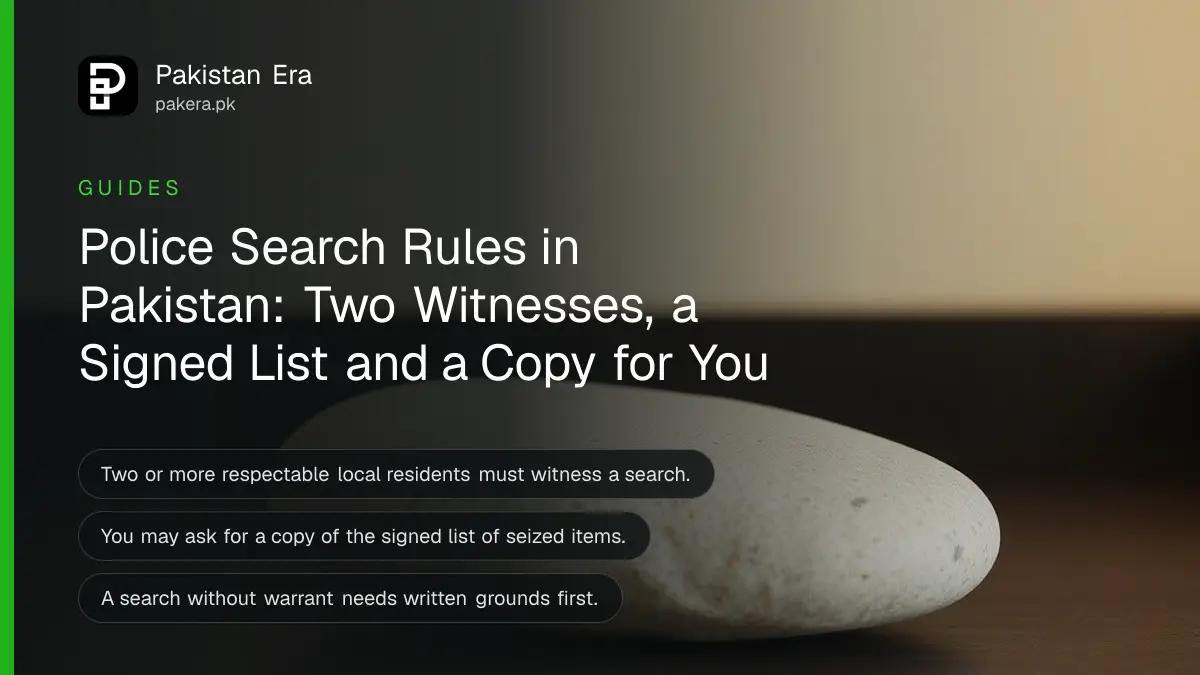 A smooth stone on a dark wooden table, for police search rights in Pakistan