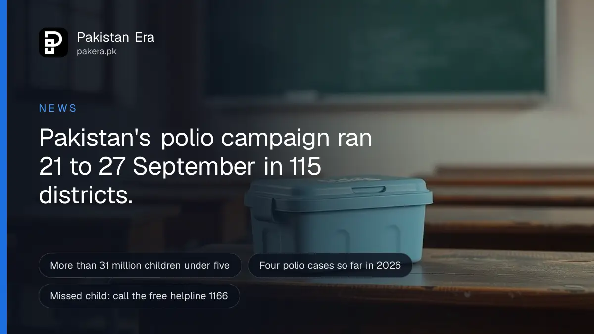 A small blue vaccine carrier box resting on a wooden school desk in a Lahore classroom, with morning light from a window