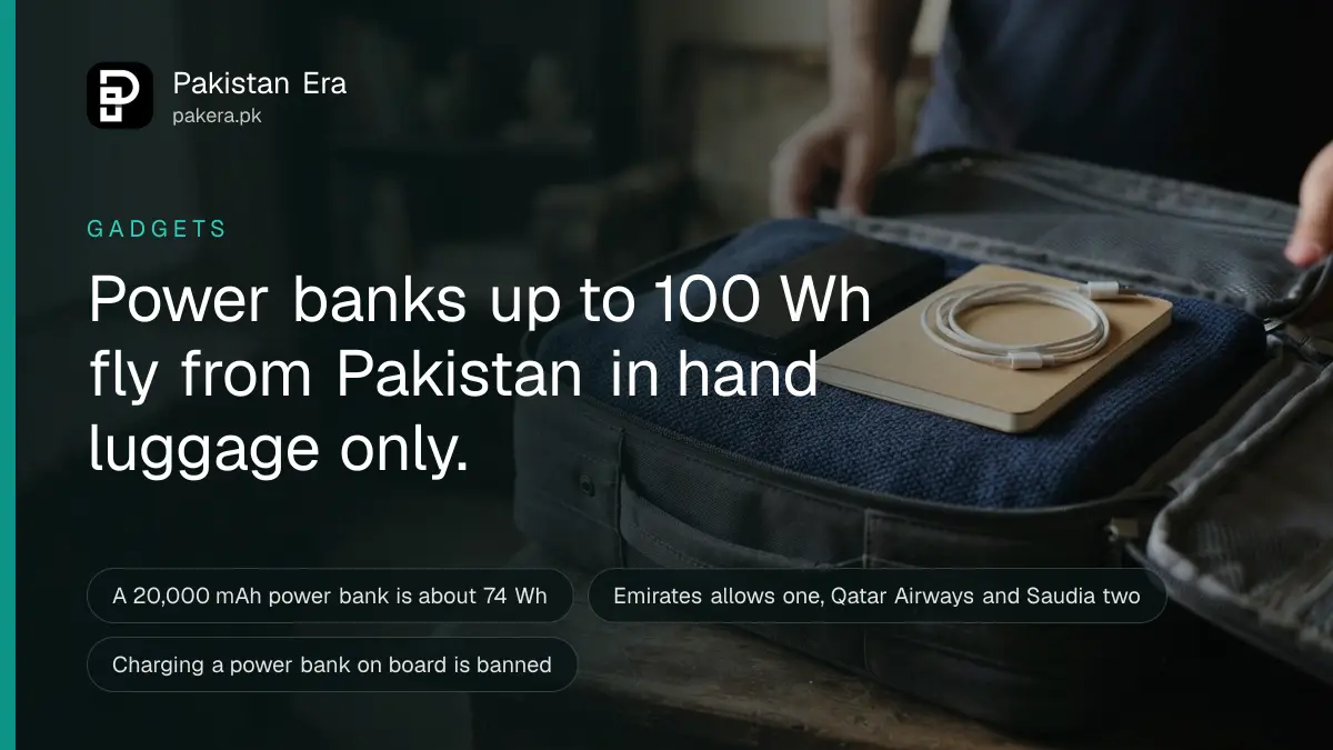 A power bank and a small plain notebook inside an open carry-on bag, ready for a flight from Karachi