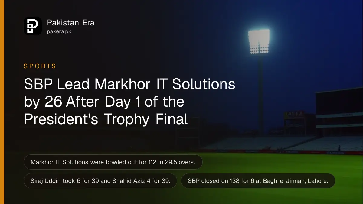 An empty cricket stadium under floodlights