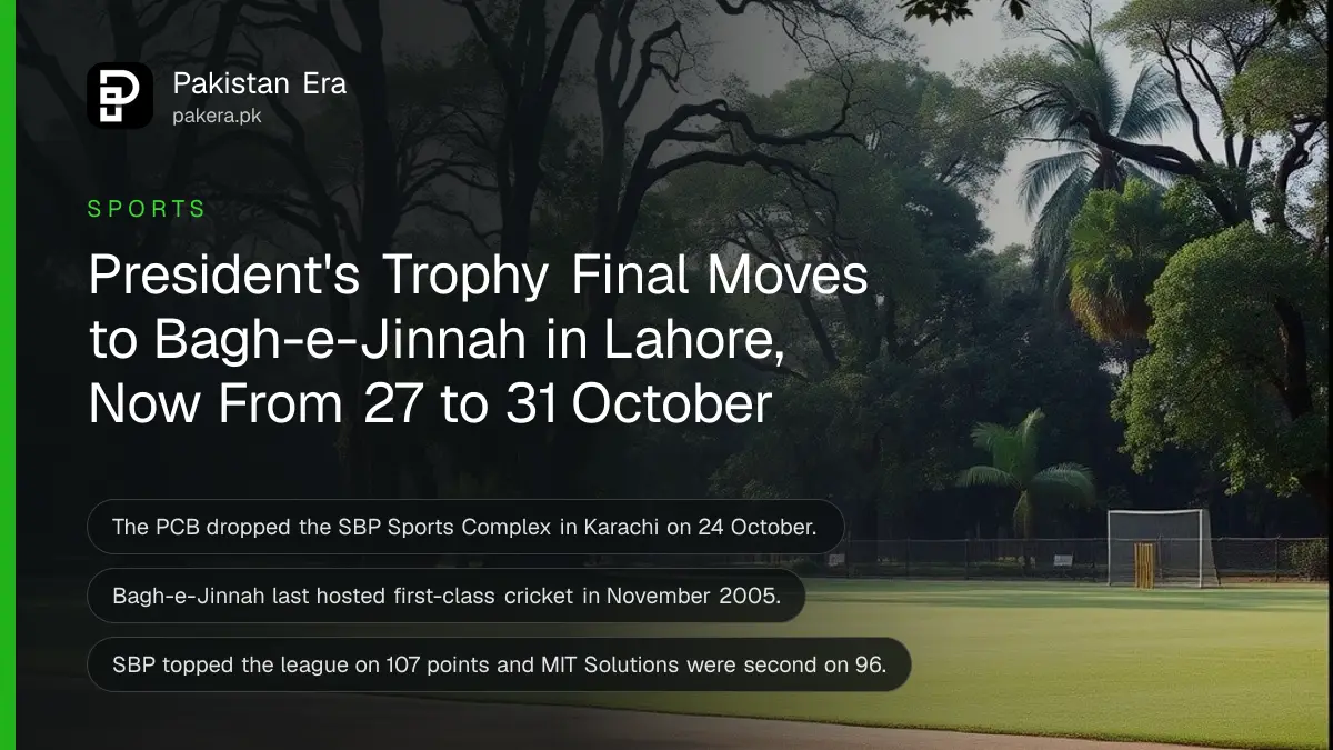 A cricket ground surrounded by tall trees