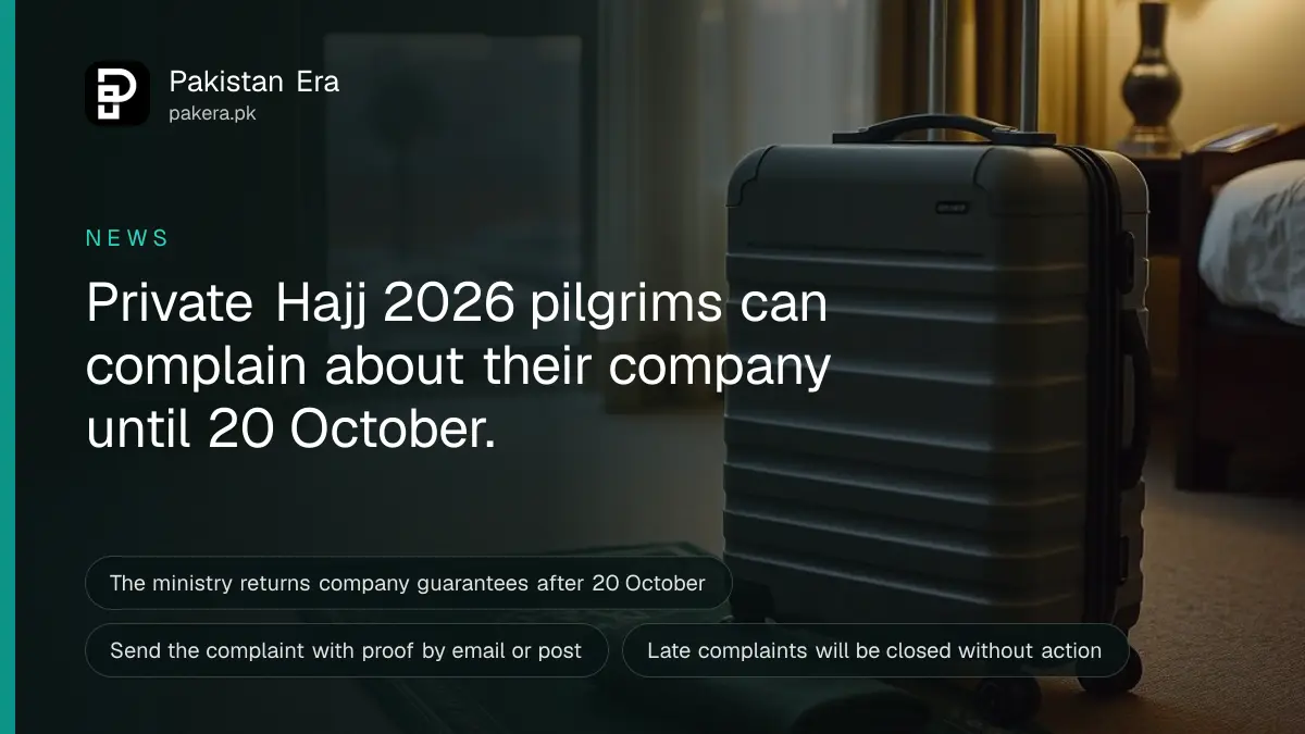 A packed travel suitcase and a folded prayer mat resting by a hotel room window with a view of a desert city at dusk