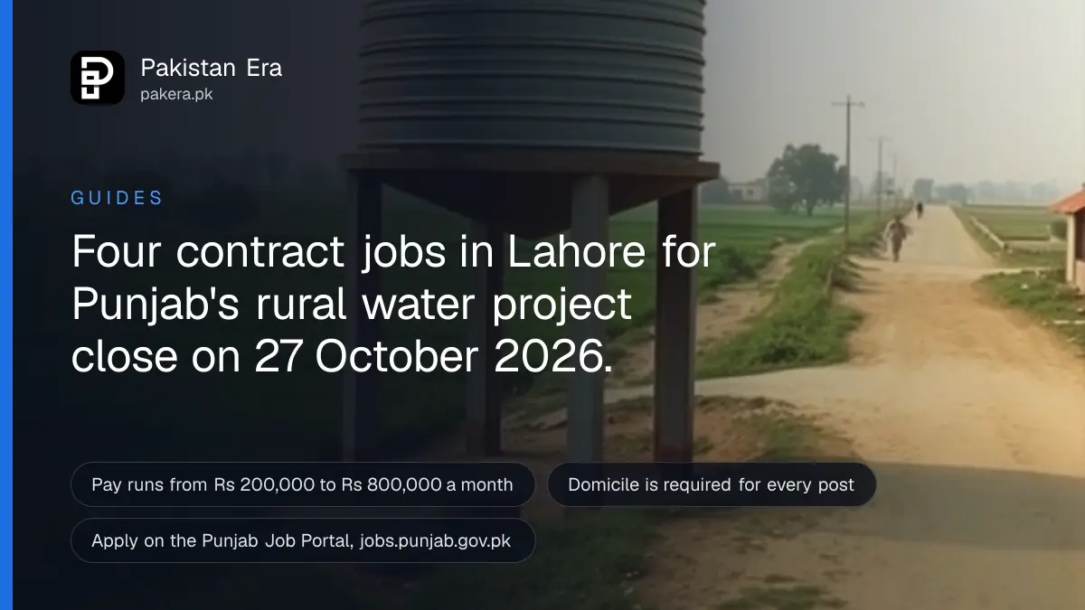 A village water tank and pipes beside green fields in rural Punjab in soft morning light
