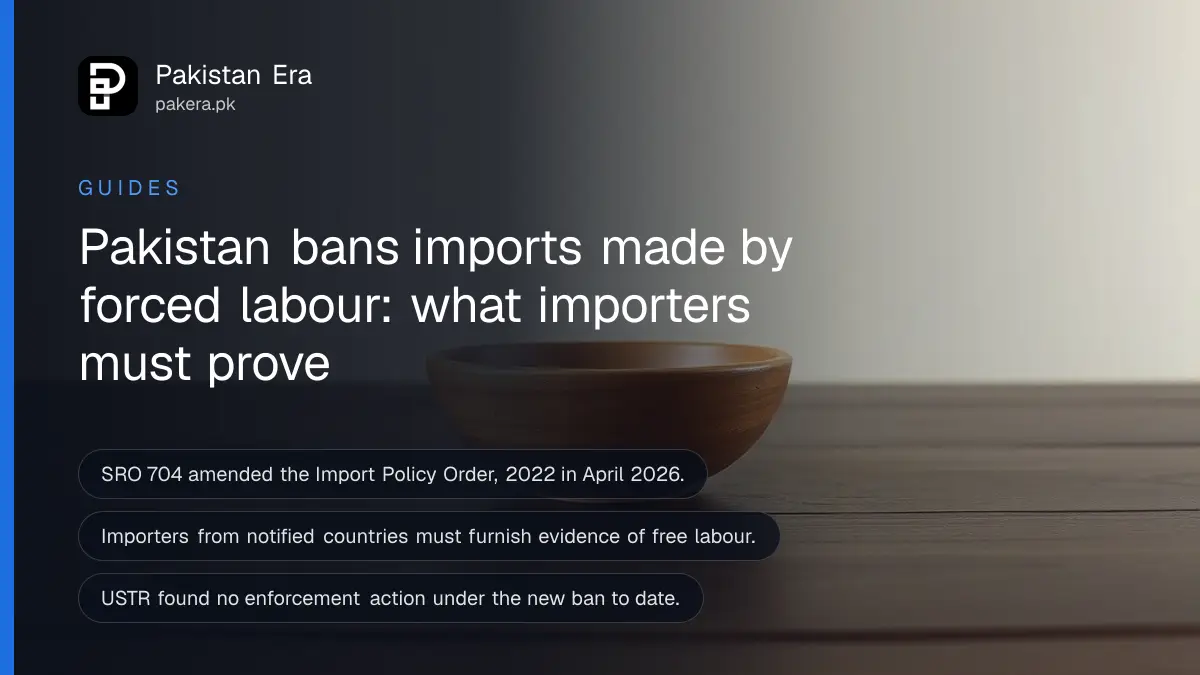 An empty wooden bowl on a dark wooden table, for an article on forced labour import ban Pakistan