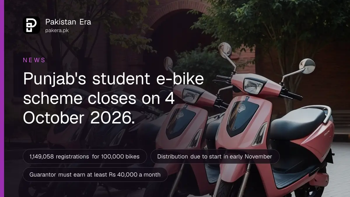 A row of new pink and black electric scooters parked in a sunny college courtyard