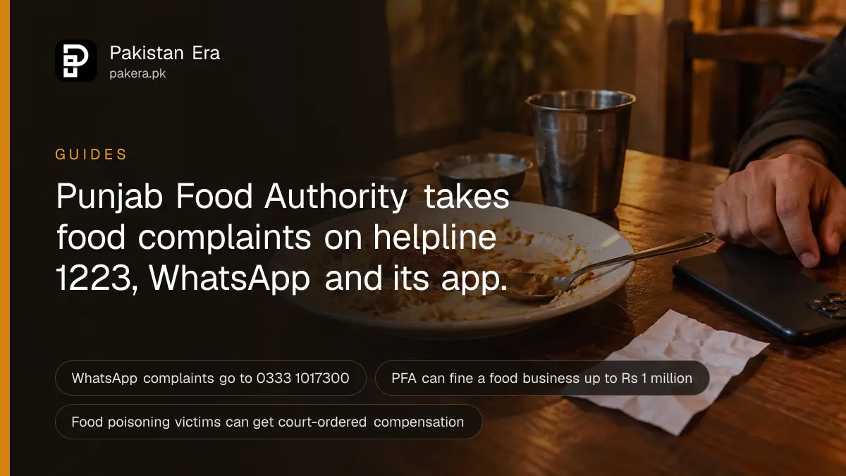 A hand holding a smartphone face down beside a half-eaten plate of food and a crumpled paper receipt on a restaurant table