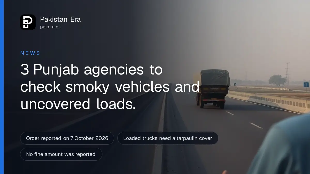 A loaded truck on a Punjab highway on a hazy autumn morning, seen from a distance
