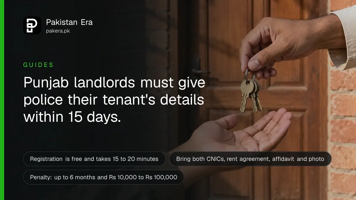 A hand passing a set of house keys to another hand at an open wooden front door