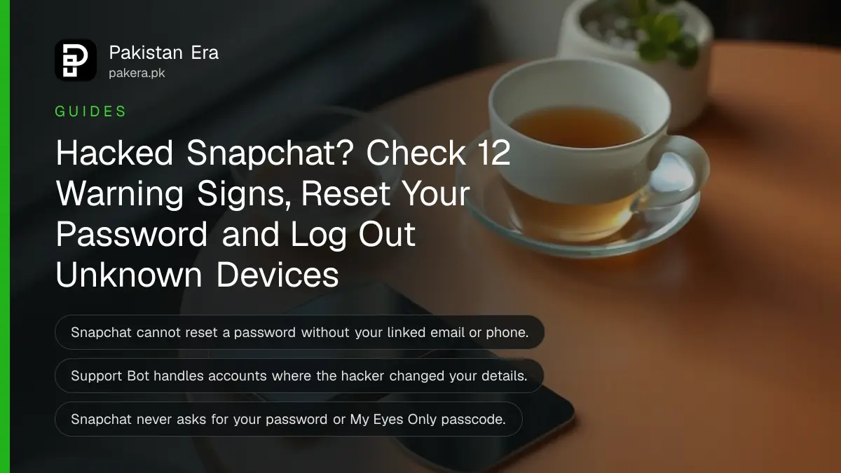 A smartphone lying face up on a café table with its screen glowing softly beside a cup of tea in soft morning light