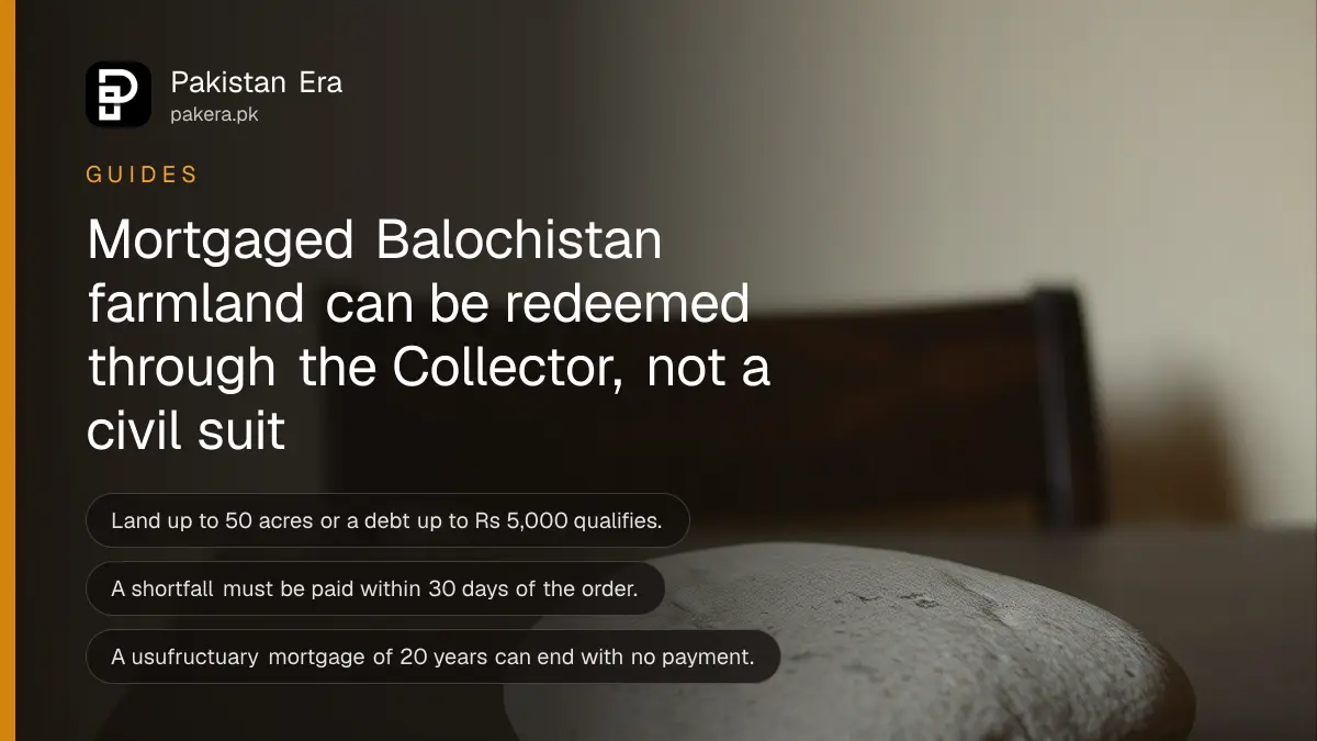 A smooth stone on a dark wooden table against a plain cream wall, for a guide to redeeming mortgaged farmland in Balochistan