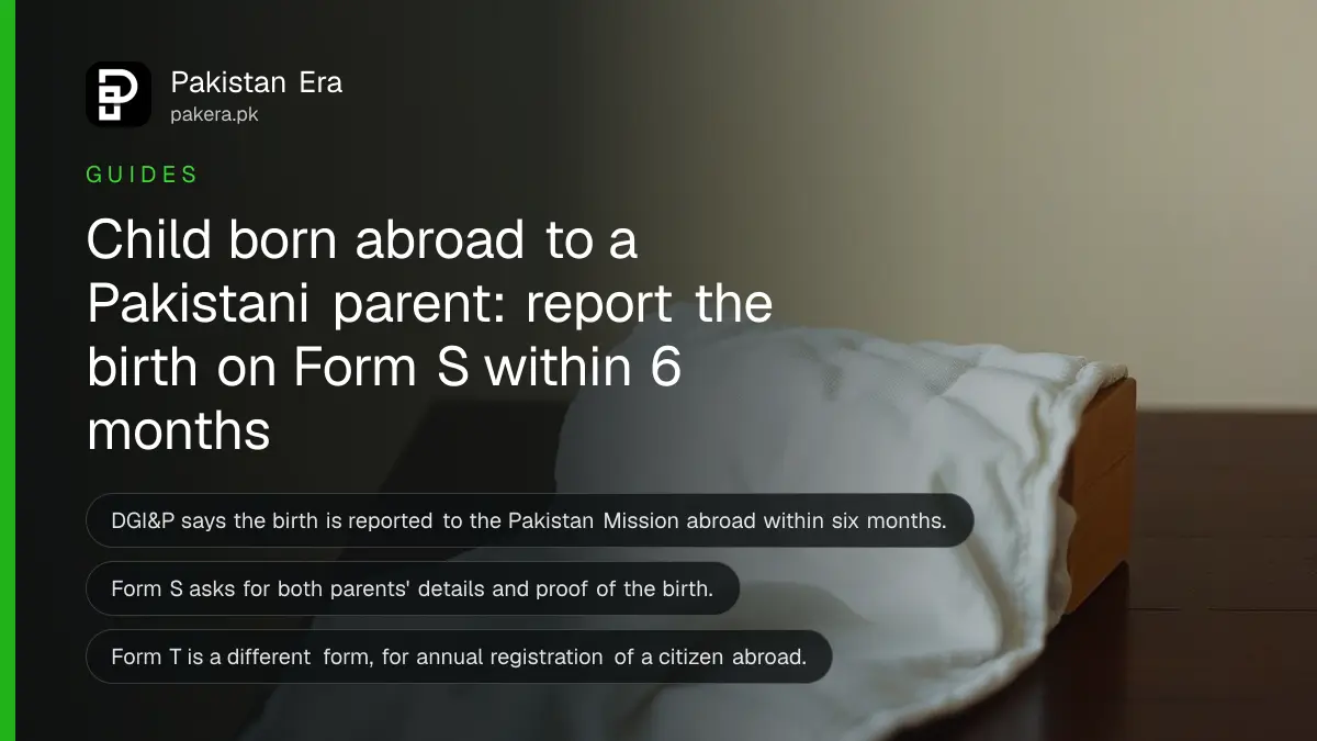 A folded baby blanket and a wooden block on a dark wooden table, for a guide on registering a child's birth abroad with a Pakistan Mission
