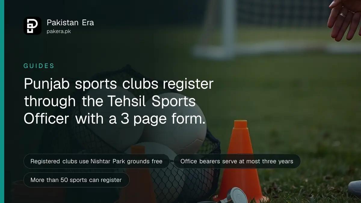 A mesh bag of footballs, a stack of orange training cones and a whistle on a grass field at sunset