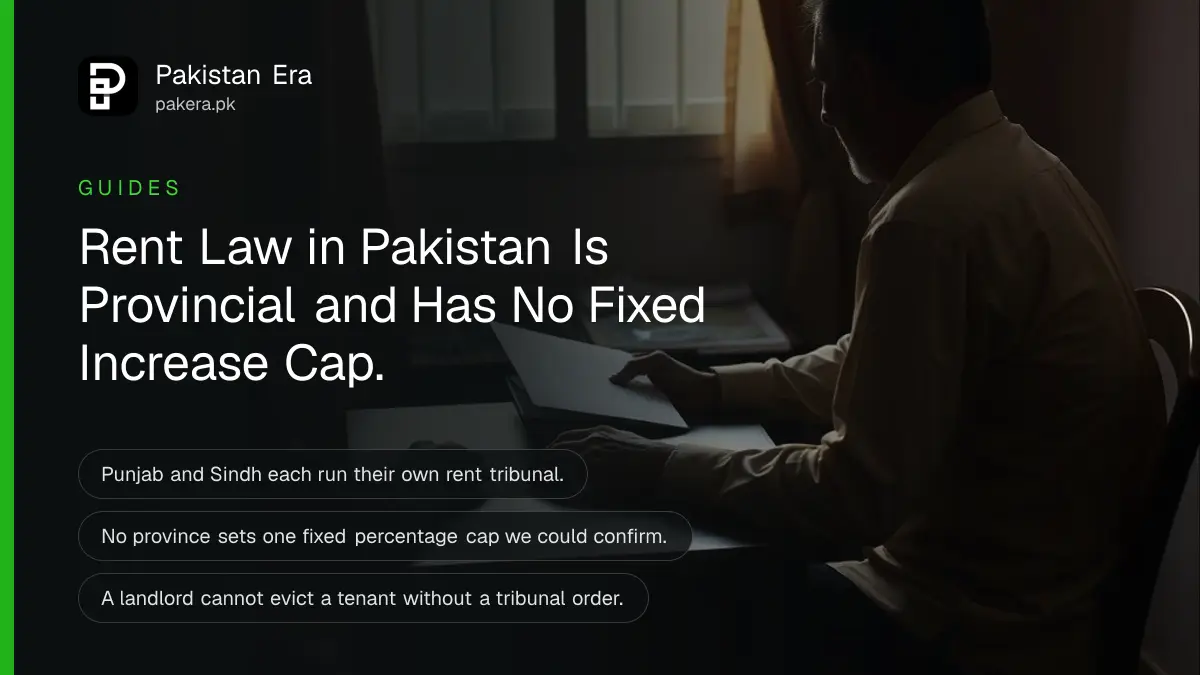 A tenant and landlord reviewing papers across a table at home, hands visible, faces out of frame