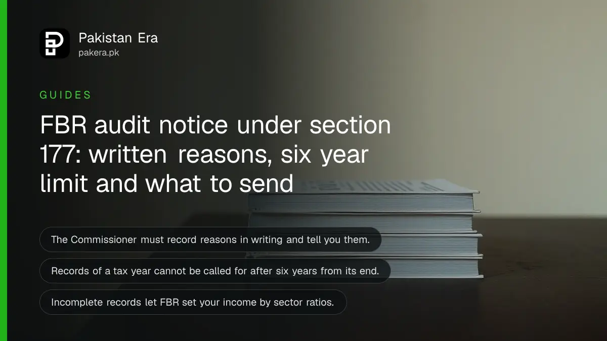 A stack of plain books on a dark wooden table, for a guide to replying to an FBR section 177 audit notice in Pakistan