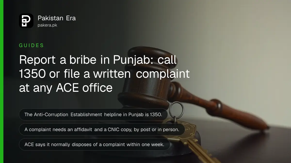 A wooden gavel and a brass key on a dark wooden table, for an article on how to report corruption in Punjab