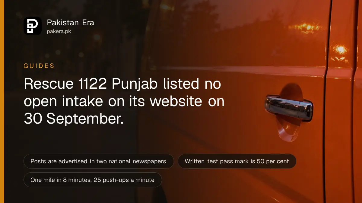 The plain orange side panel of an ambulance at dusk in Lahore, softly blurred