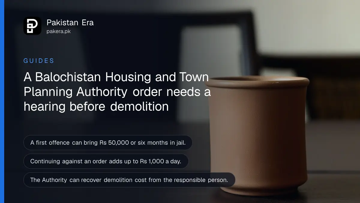 A clay cup on a dark wooden table against a plain cream wall, for a guide to Balochistan housing authority orders