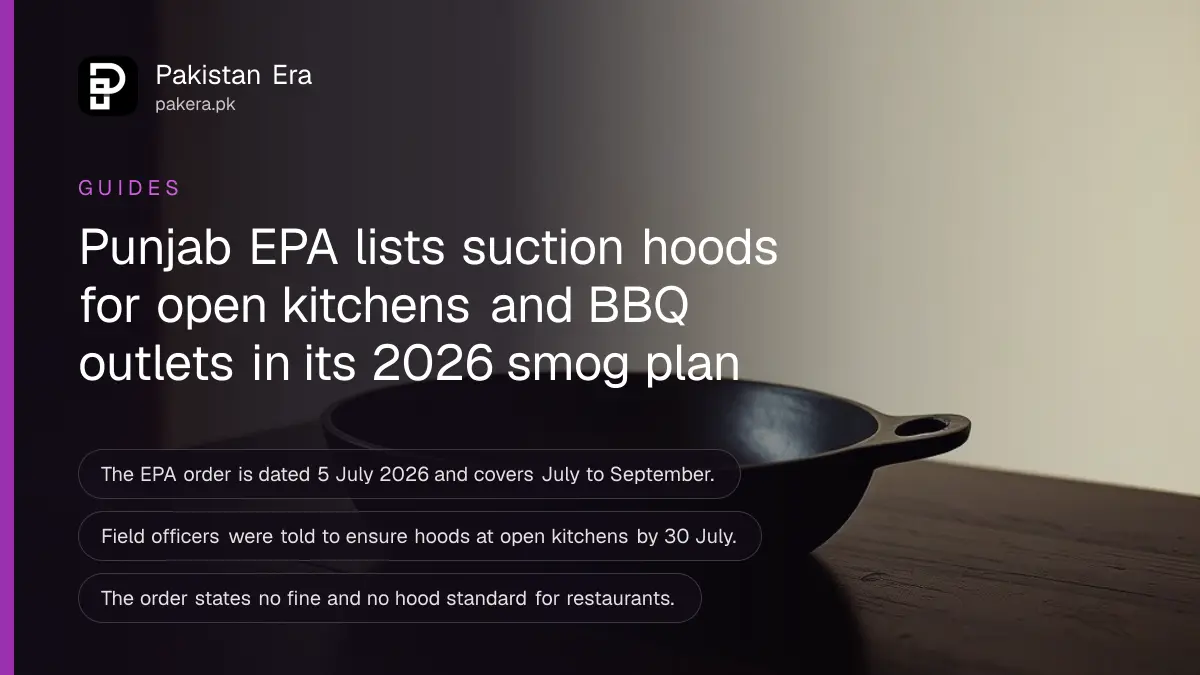 A black cast iron frying pan on a dark wooden table, for a guide on restaurant suction hoods in Punjab