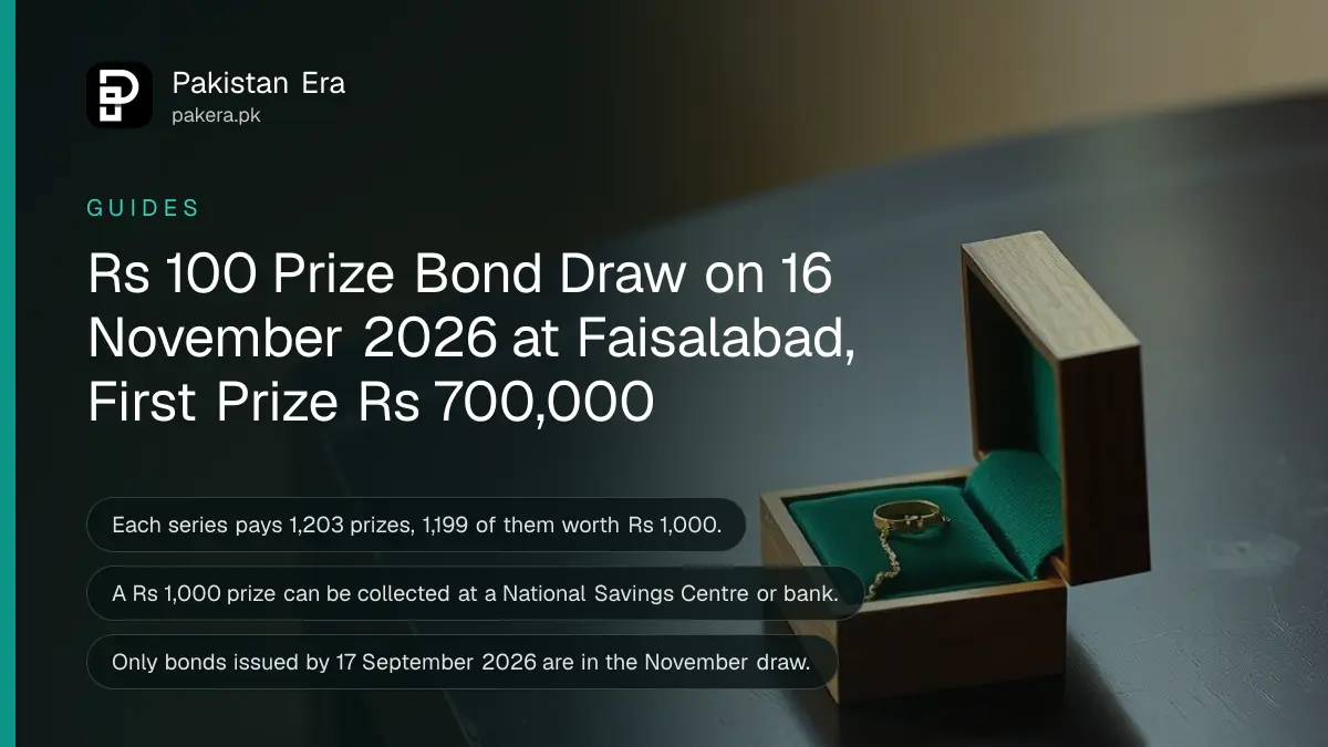 A small open wooden box lined with green velvet holding a gold ring and a thin gold chain