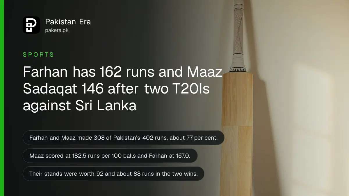 A plain wooden cricket bat standing against a cream wall on a dark wooden floor