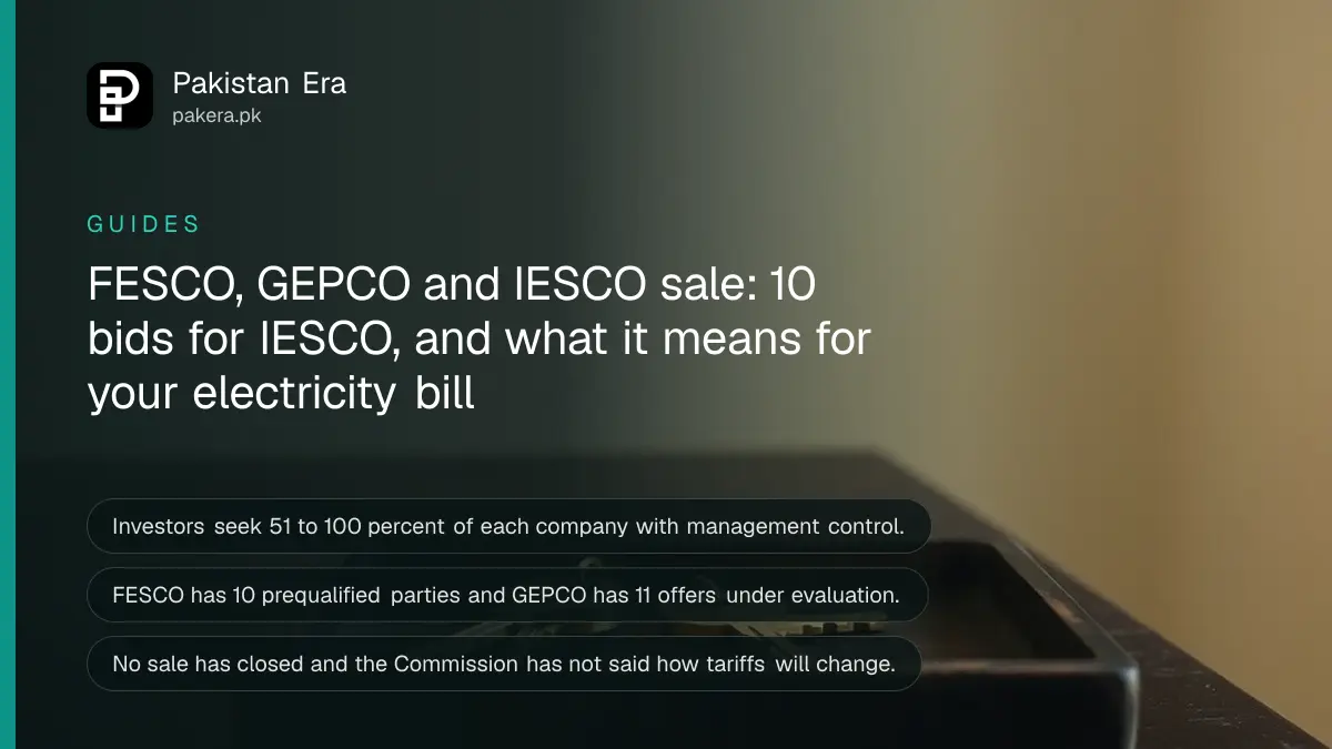 Two brass keys on a wooden tray on a dark table, for a report on the sale of electricity distribution companies in Pakistan