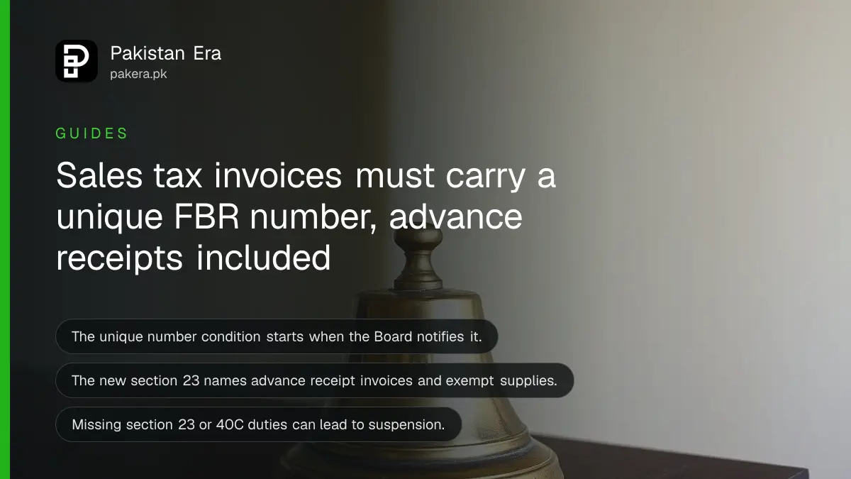 A solid brass bell on a dark wooden table, for a guide on sales tax invoices in Pakistan
