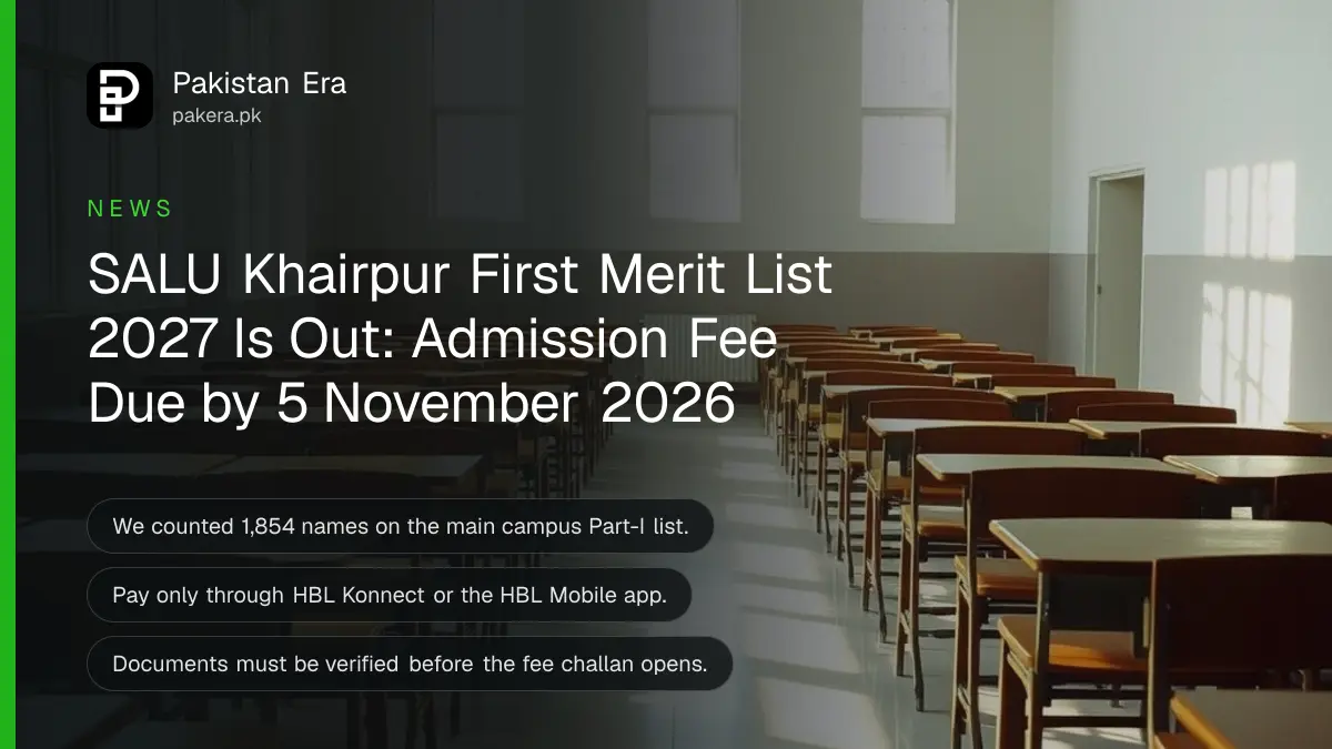 Rows of empty wooden exam desks in a bright university hall