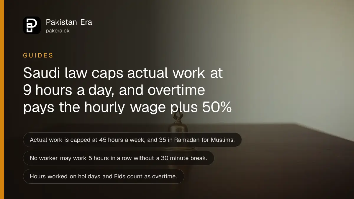 A small brass bell on a dark wooden table, for an article on saudi working hours law