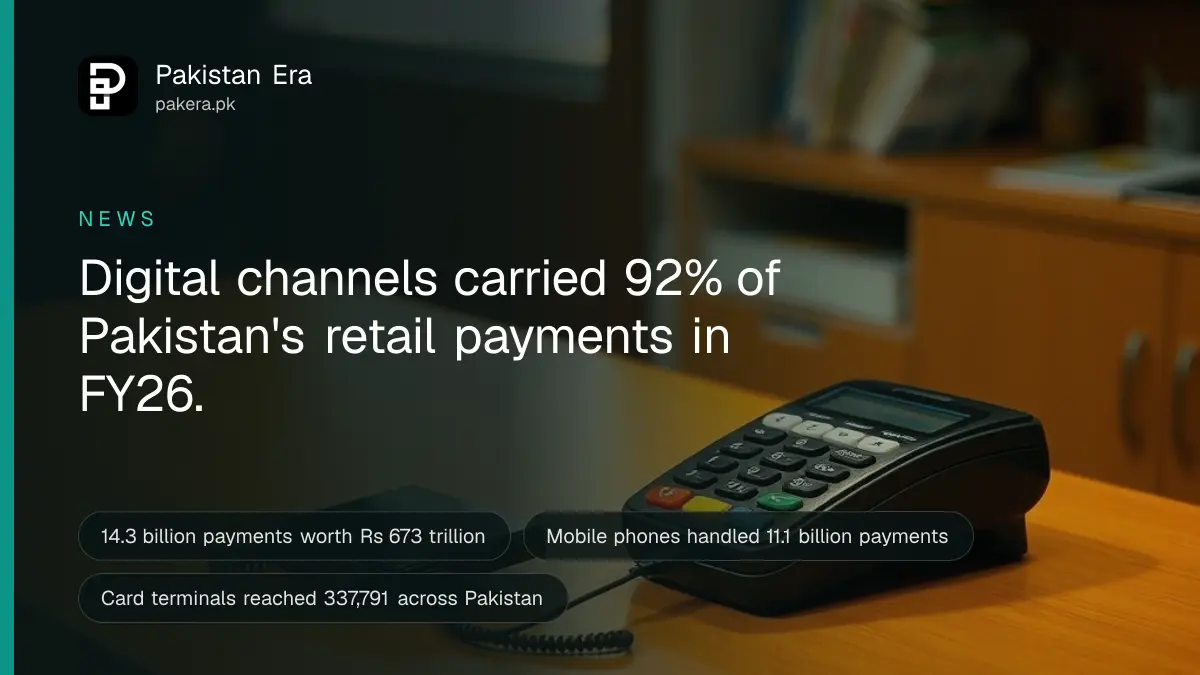 A shop counter in Karachi with a card machine and a phone stand for QR payments