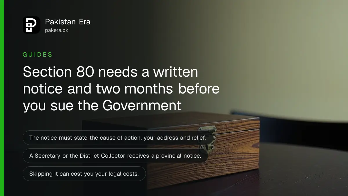 A closed wooden box with a brass clasp on a dark wooden table, for a guide on notices before suing the Government in Pakistan