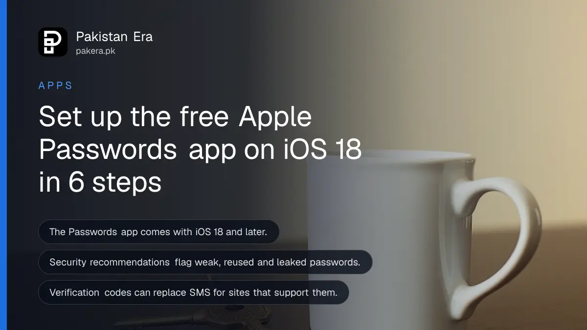 A brass key beside a plain white mug on a dark wooden table, for an article on the Apple Passwords app