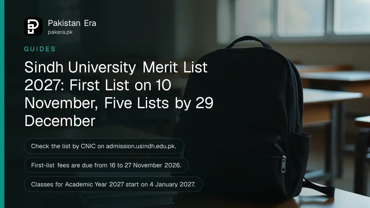 A school bag and a stack of plain notebooks on an empty wooden classroom desk in morning light