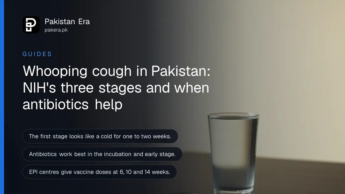 A glass of water on a dark wooden table, for an article on whooping cough pakistan