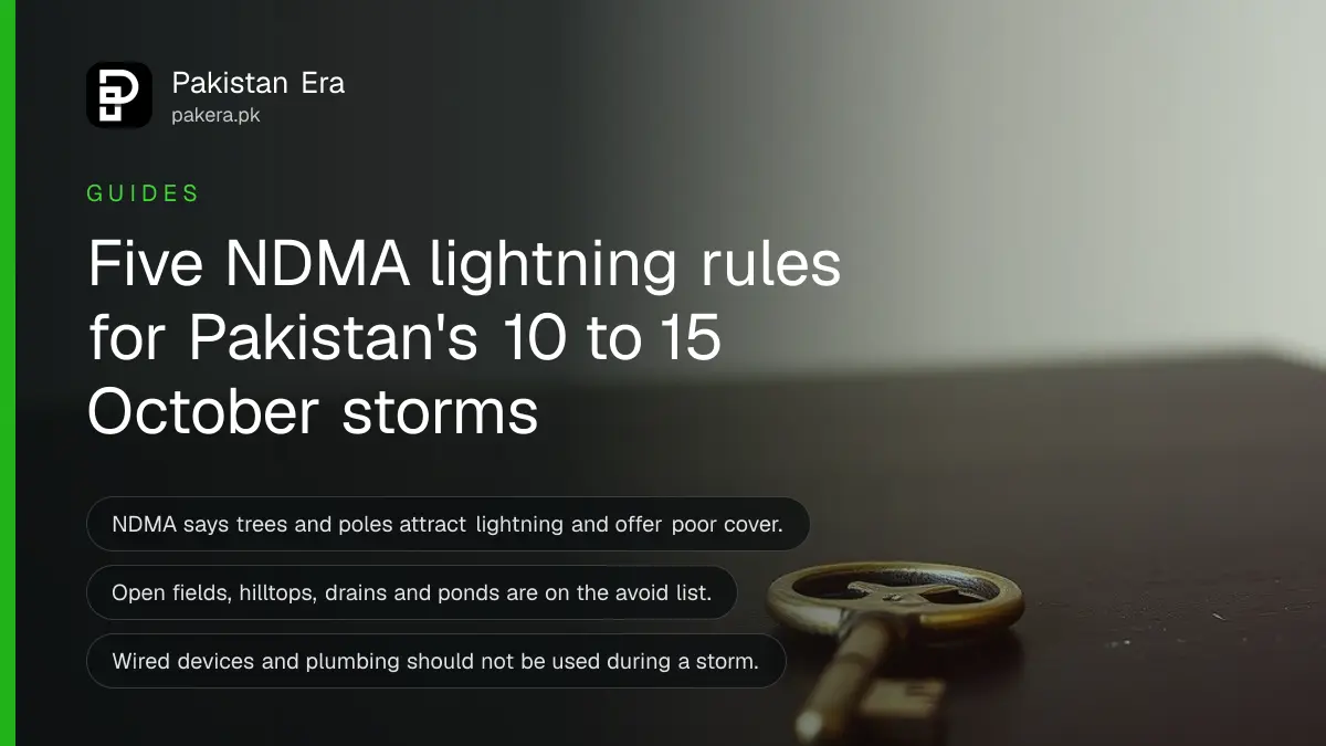 A brass key on a dark wooden table, for a guide on lightning safety in Pakistan