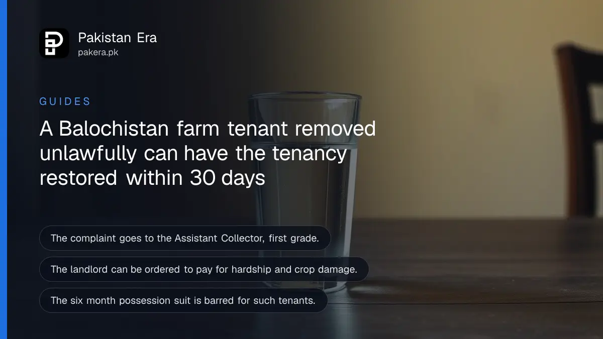 A glass of clear water on a dark wooden table against a plain cream wall, for a guide to farm tenant rights in Balochistan