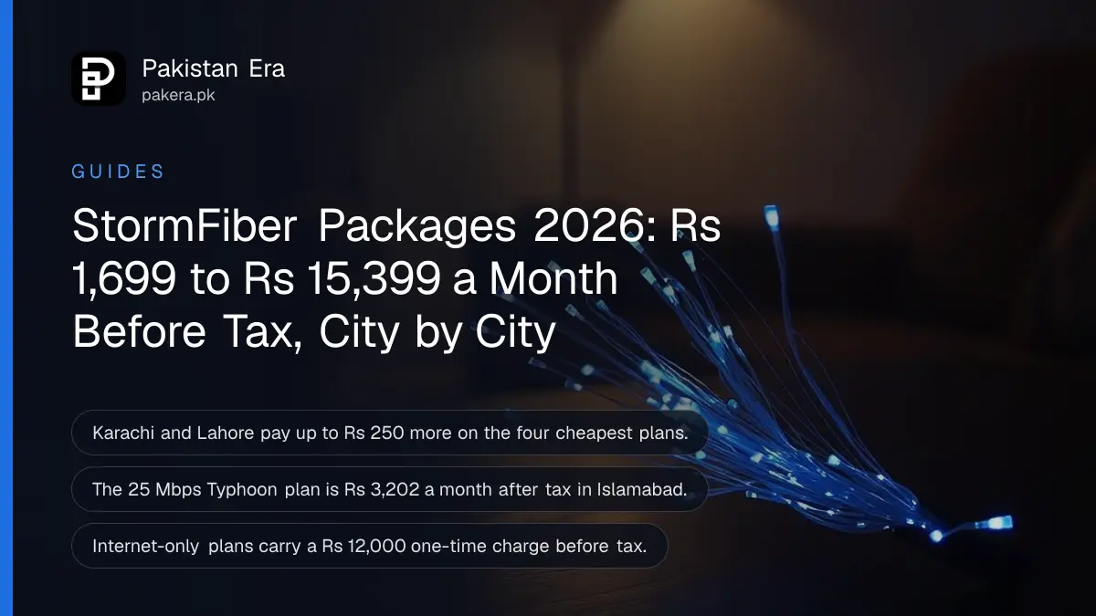 A bundle of thin fibre optic strands glowing blue at their tips on a dark wooden desk in a living room