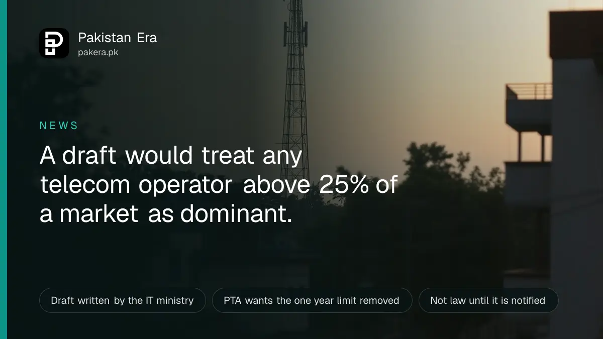A mobile network tower seen from a quiet street in Pakistan at dusk