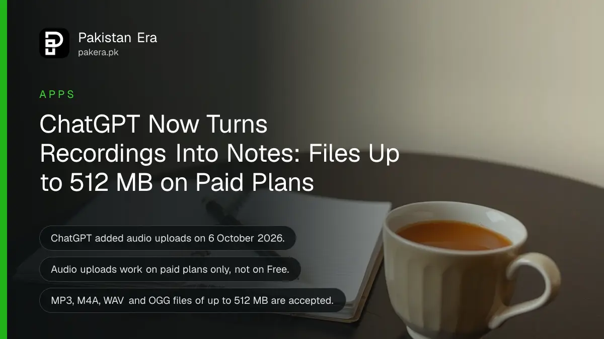 A small black voice recorder beside an open spiral notebook, a pencil and a cup of chai on a wooden table