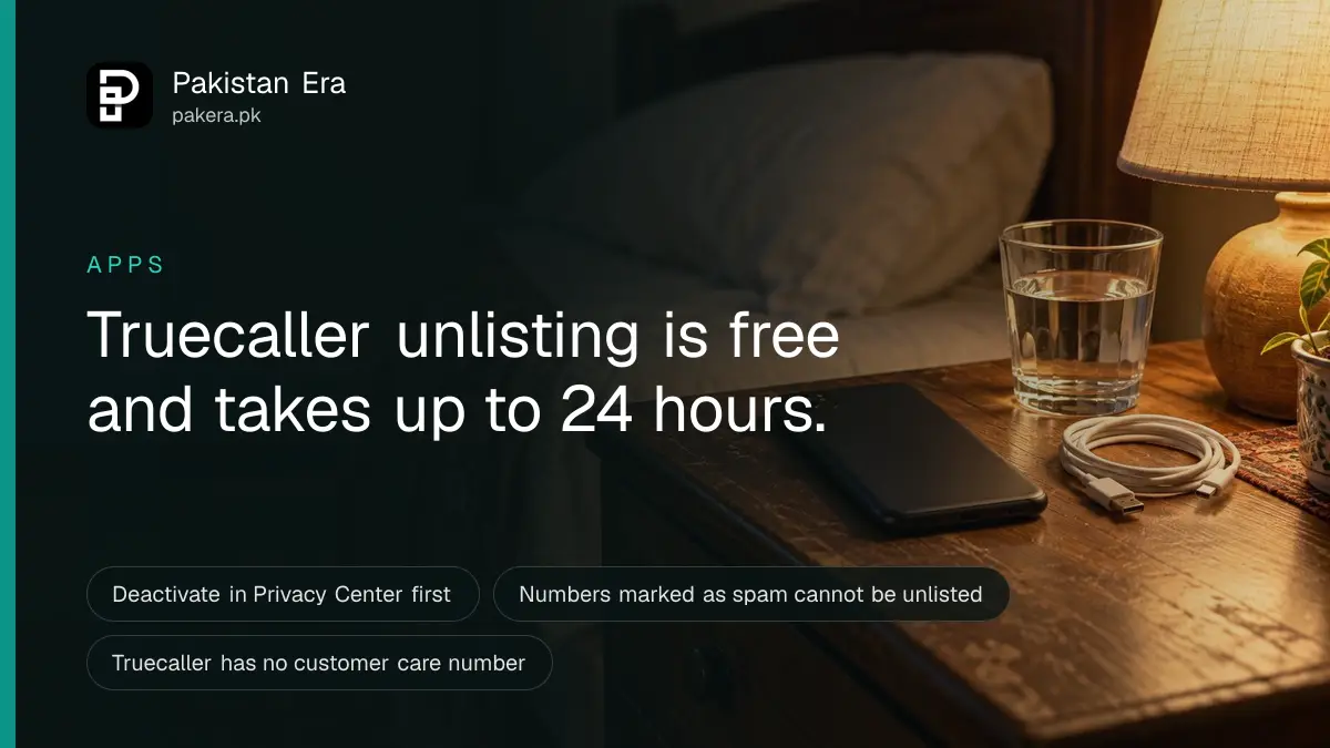 A dark phone lying face down on a bedside table beside a charging cable and a glass of water