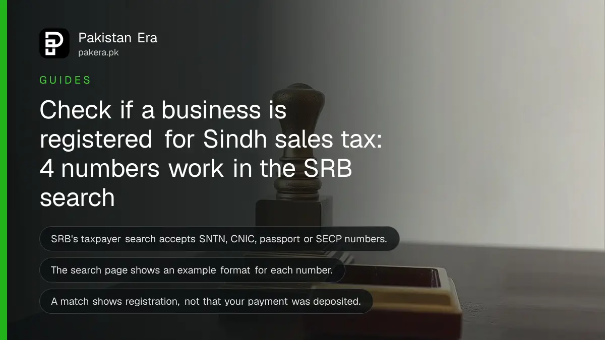 A brass desk stamp on a dark wooden table, for a guide to the SRB taxpayer search in Sindh