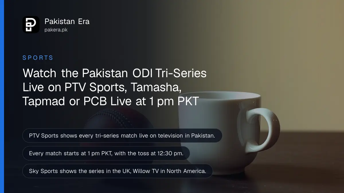 A red cricket ball and a white tea cup on a dark wooden table, for watching the Pakistan ODI tri-series live