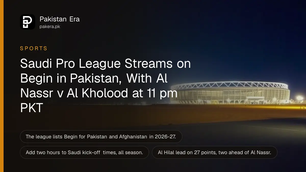 A floodlit football stadium at night seen from far away across a desert plain