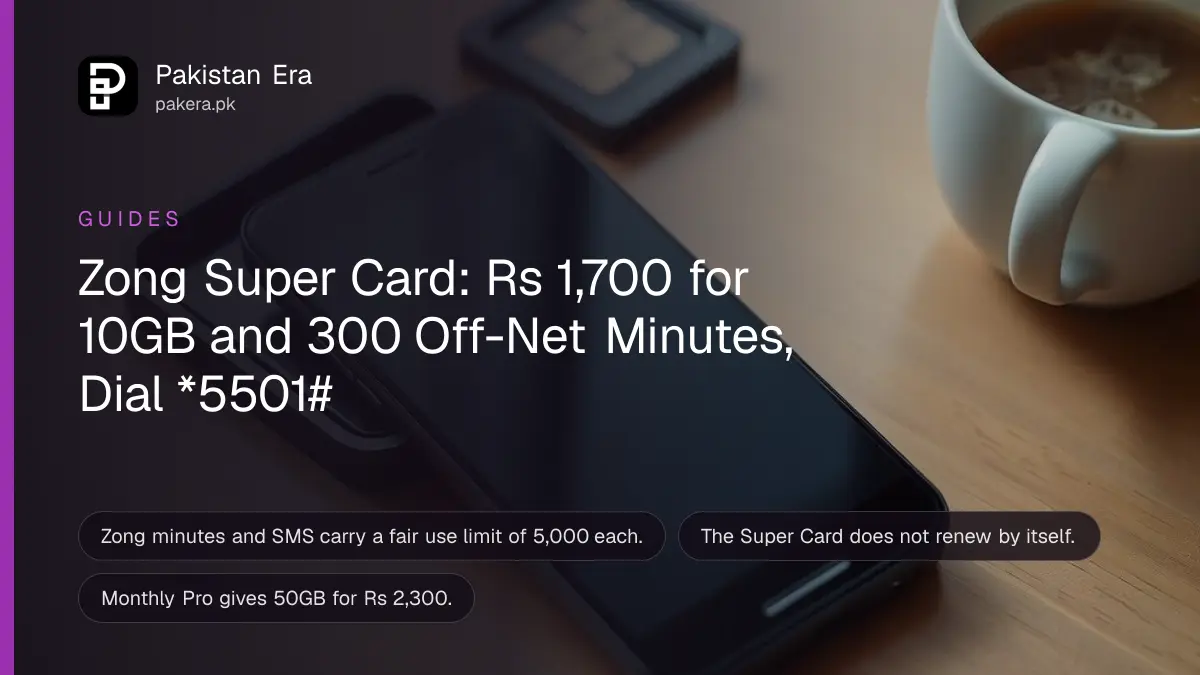 A smartphone lying face up on a wooden desk beside a small SIM card tray and a cup of tea